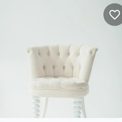 A tufted armchair listed on Relio